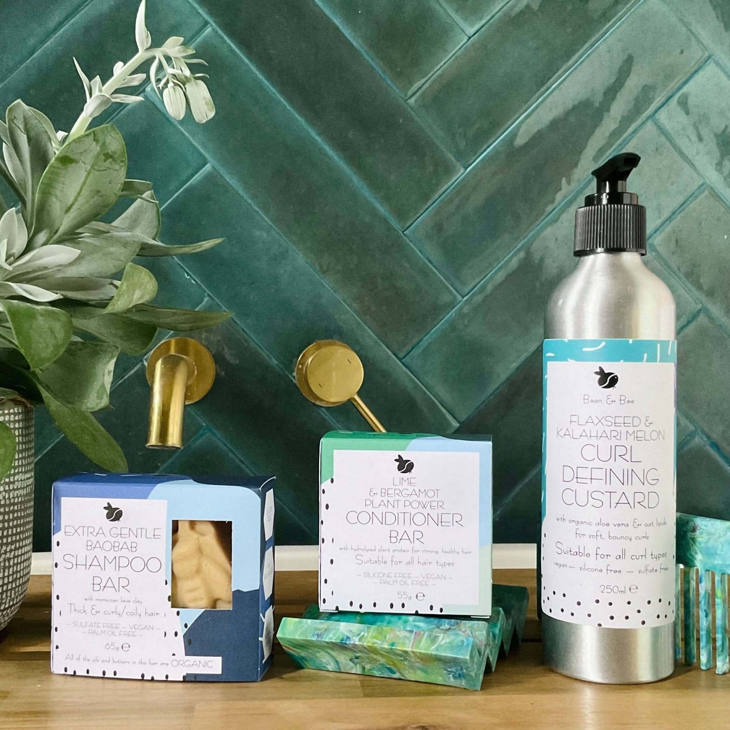 The Curly One haircare products: shampoo bar, conditioner, and defining custard for frizz-free, hydrated curly hair.